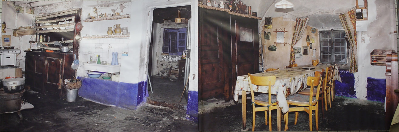 Cuisine ancienne, vaisselier et table dressée dans une maison de la vallée
